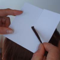 Using a hair protector card to make braiding easier Using a hair protector card to make braiding easier