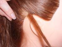 Or select hair behind one ear Or select hair behind one ear